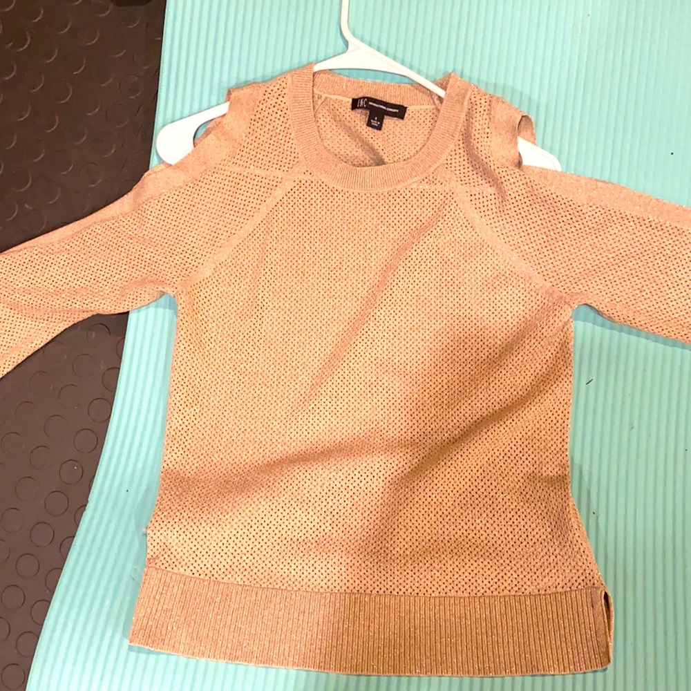 Unique sweater-bow cuffs and exposed shoulders